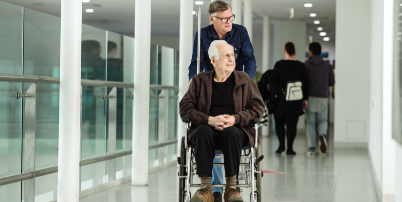 Patient in a wheelchair and his carer at Austin Hospital